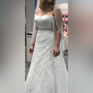 A-line, strapless wedding dress from David’s Bridal. Size 12. Corset added.